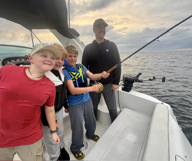 Kids enjoying a fishing charter near Nanoose Bay